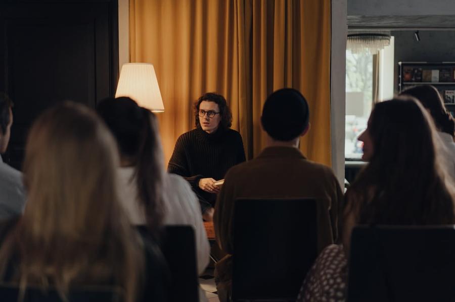 An author speaks in front of an audience.