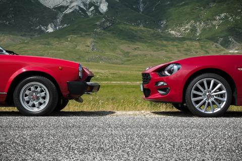 Two red cars facing one another.