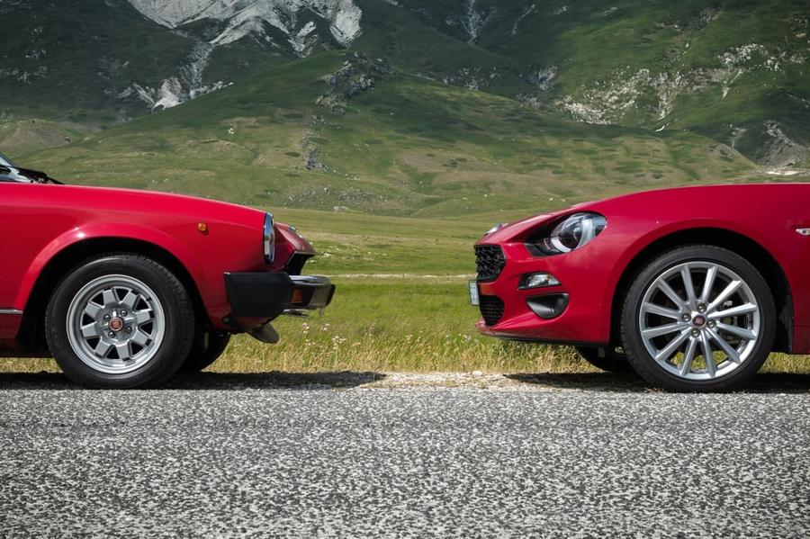 Two red cars facing one another.
