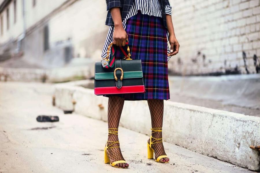 A woman wearing fashionable clothing.