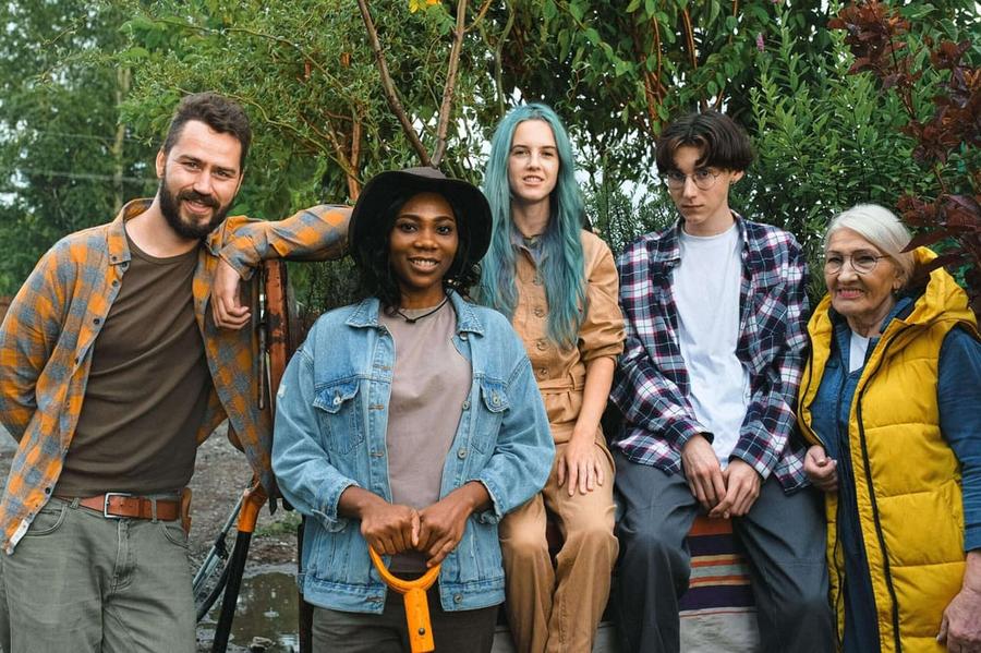 A group of people standing together, facing the camera.