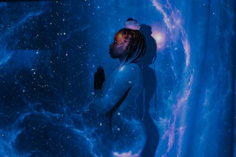 Stars projected onto a person.