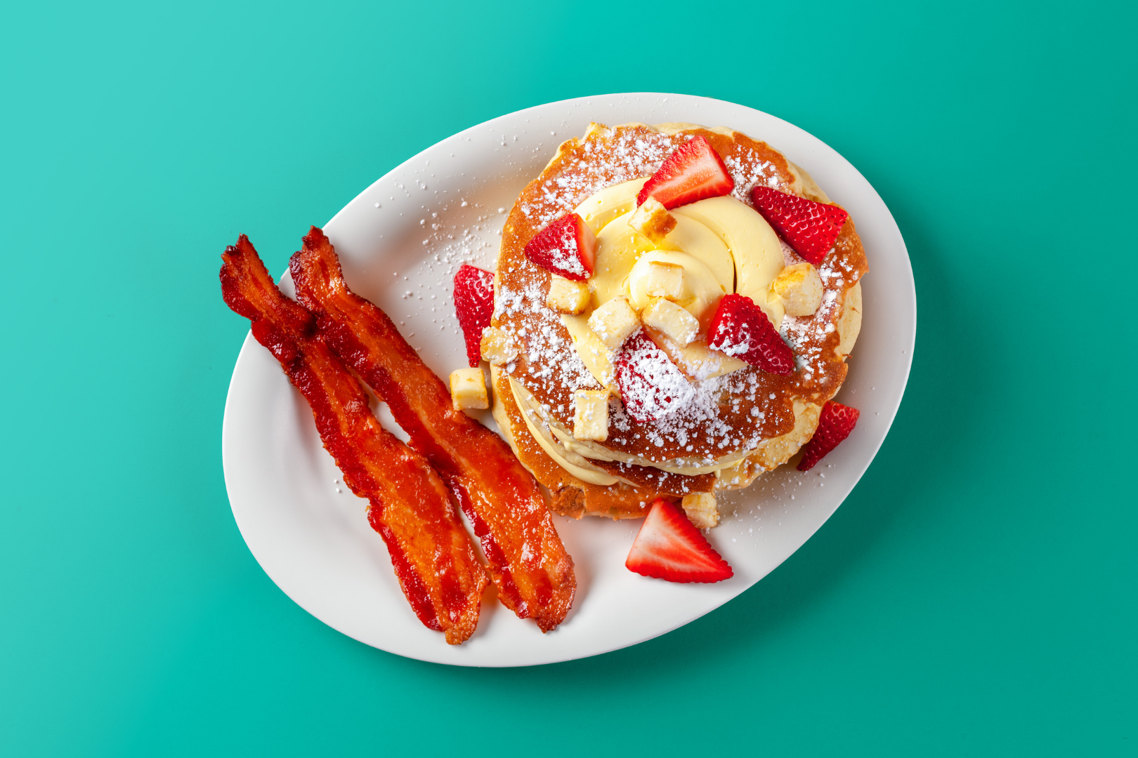 Pancakes with strawberries and bacon