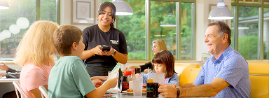 Family dining at Eggs Up Grill