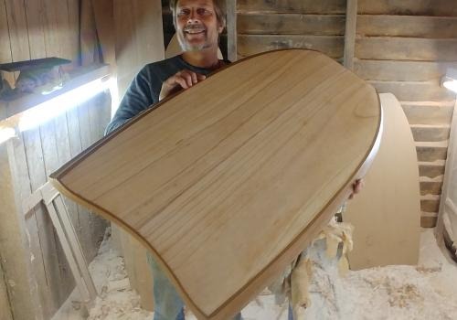 Tom Wegener with a Corky board cross-section in the workshop