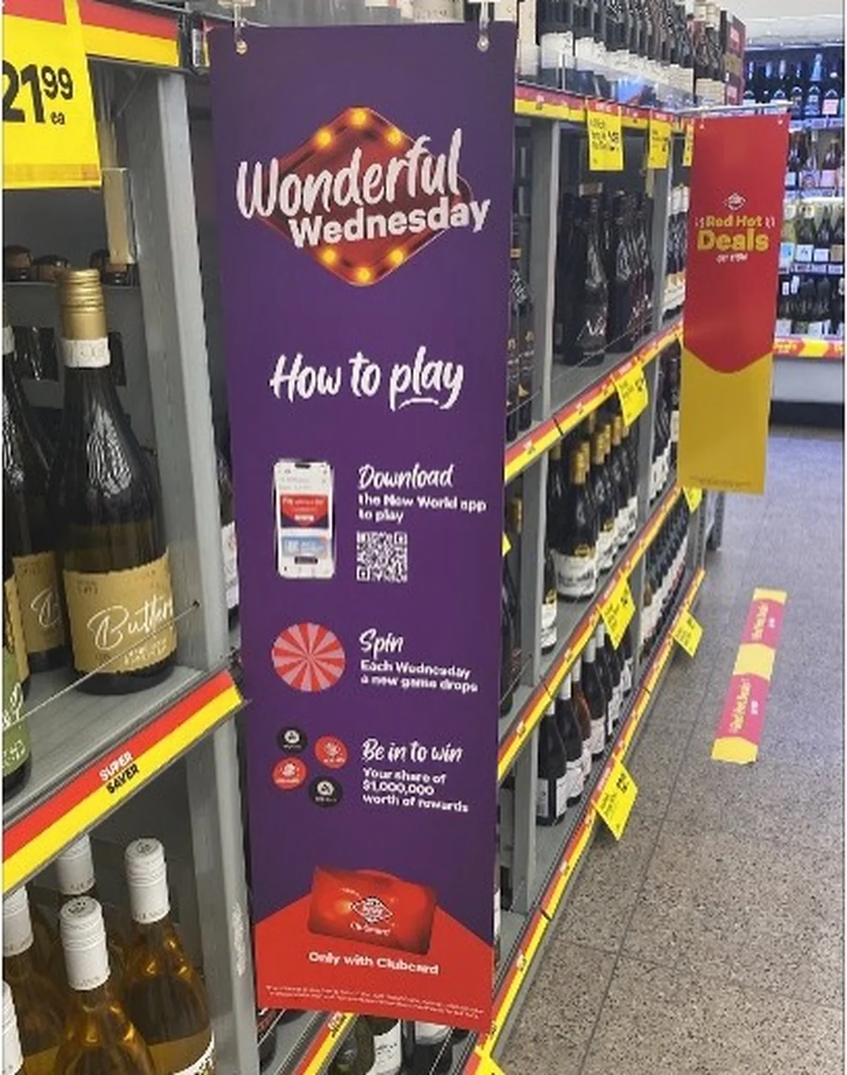 In-store aisle banner promoting the New World Wonderful Wednesday game