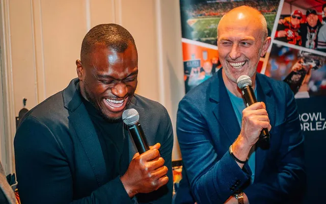 Efe Obada and our host sharing a laugh at an Elite hosted evening.
