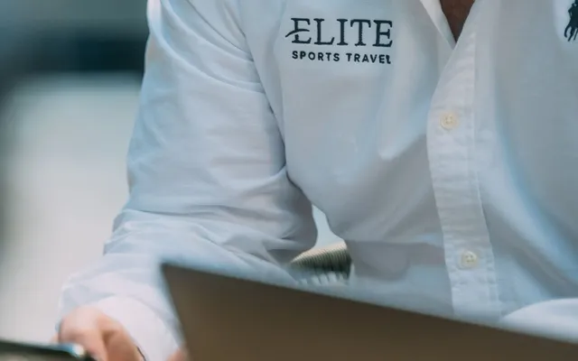 An Elite Sports Travel specialist at work.