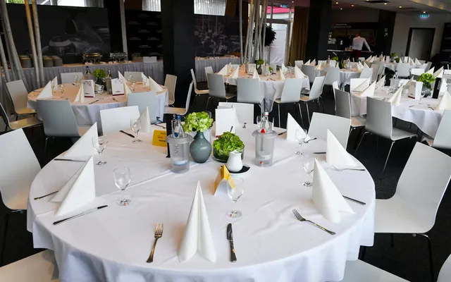 Tables laid in a hospitality suite above the circuit.