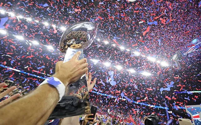 The Vince Lombardi Trophy held aloft in the confetti.