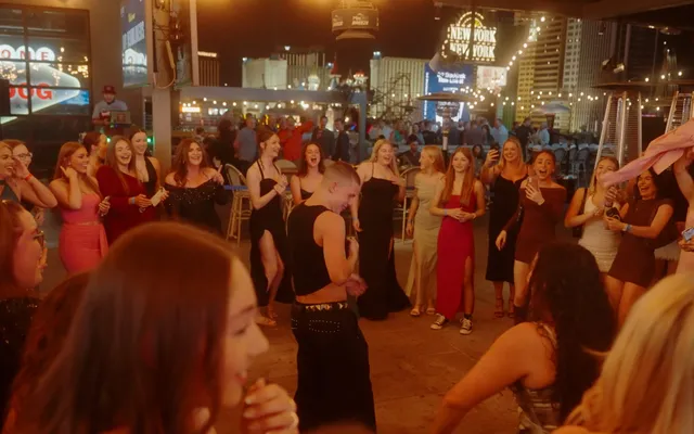 The wrap party on a rooftop over the Strip, the New York New York sign behind