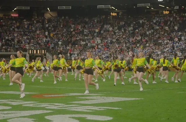 Performers mid-routine on the Allegiant Stadium field