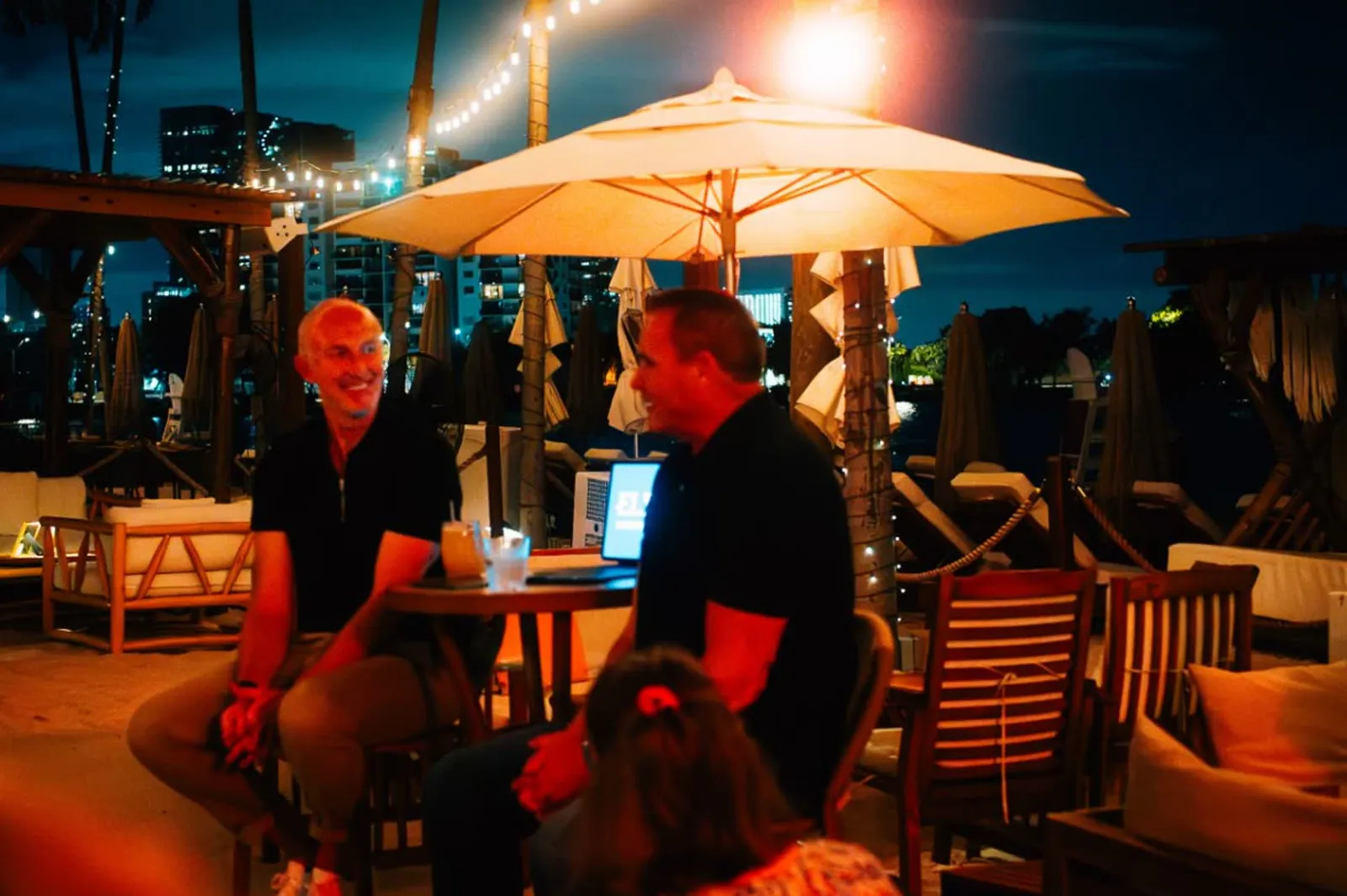 Neil Reynolds interviewing a special guest at a hosted evening under the lights