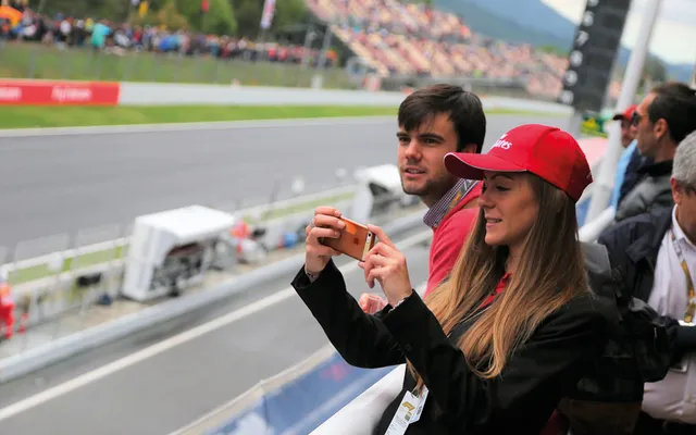 Guests on the Paddock Club balcony above the pit lane.