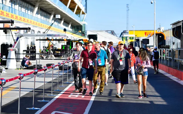 Guests walking the pit lane before the session.
