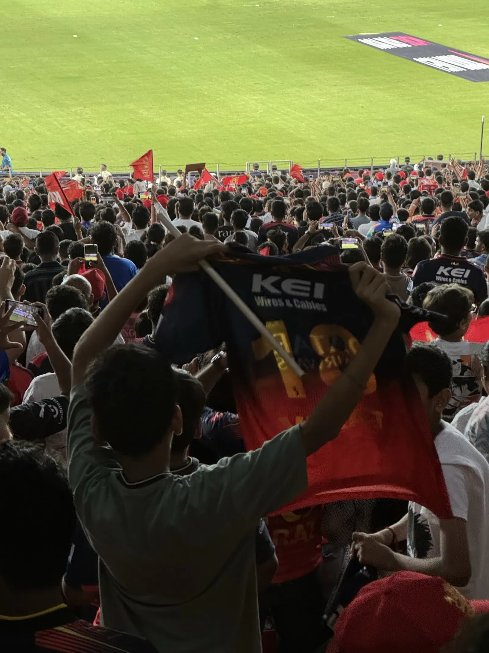 Fans holding shirts aloft at the IPL Final