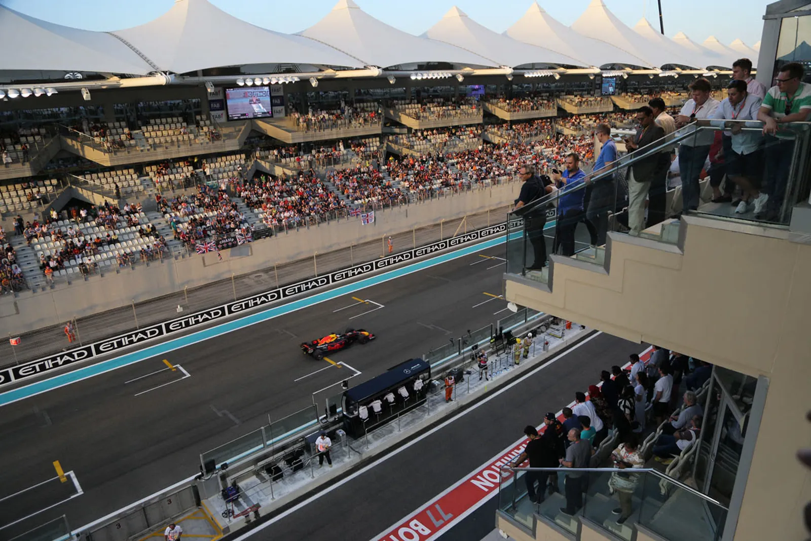 The pit straight at dusk from Paddock Club hospitality.