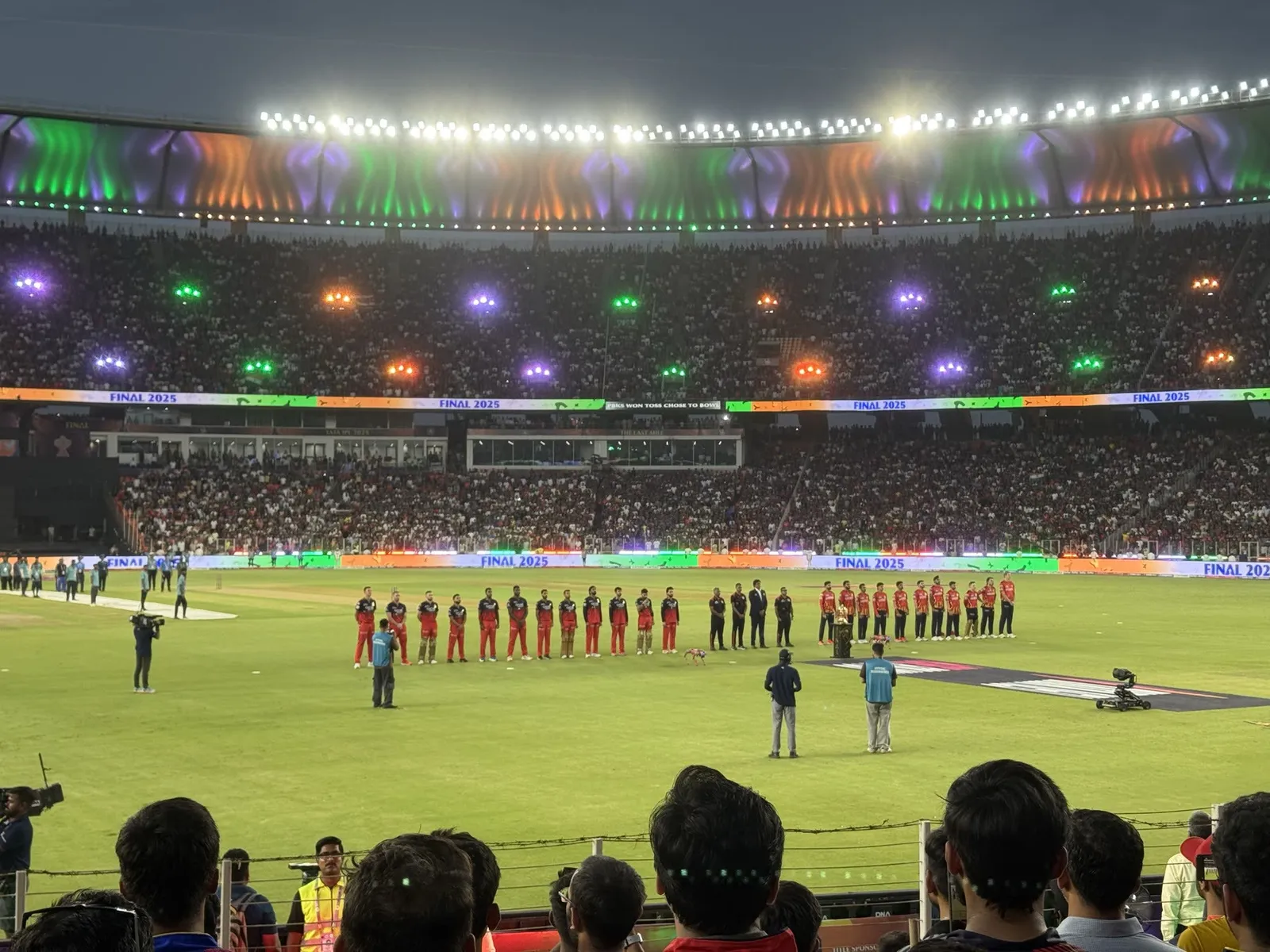 The floodlit IPL Final, teams lined up before the toss
