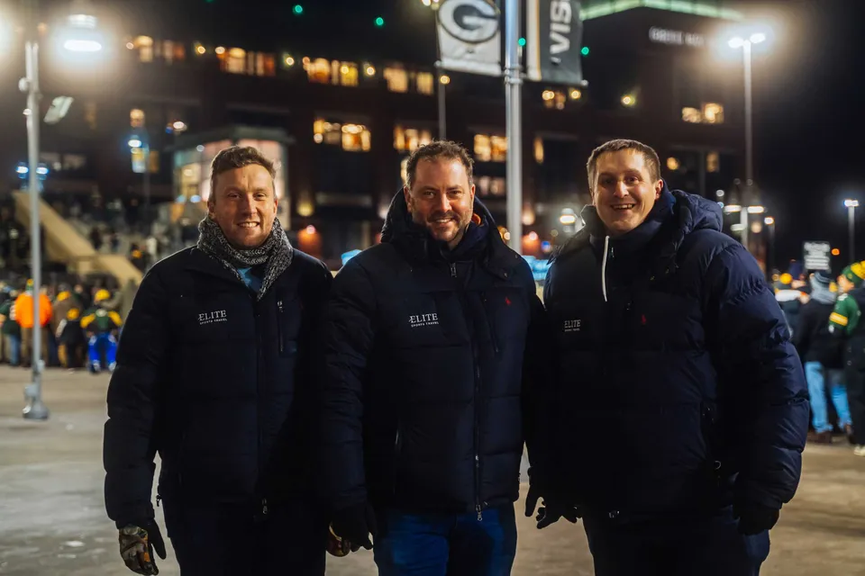 The Elite Sports Travel team outside Lambeau Field on a match night.