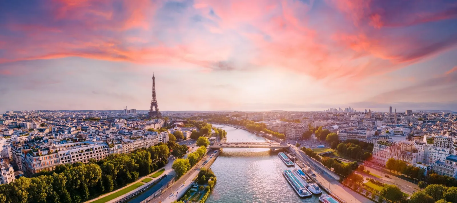 The Seine and the Paris skyline at sunset.