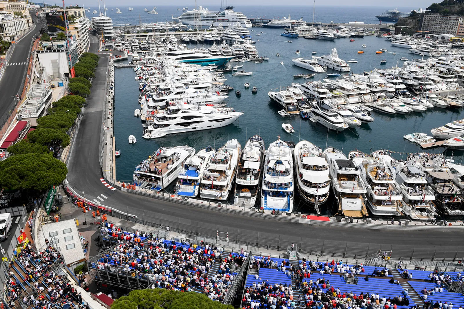 Monaco harbour on race weekend, yachts and grandstands.
