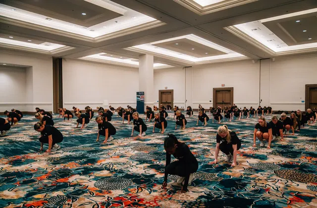 Dancers working through choreography in the hotel ballroom