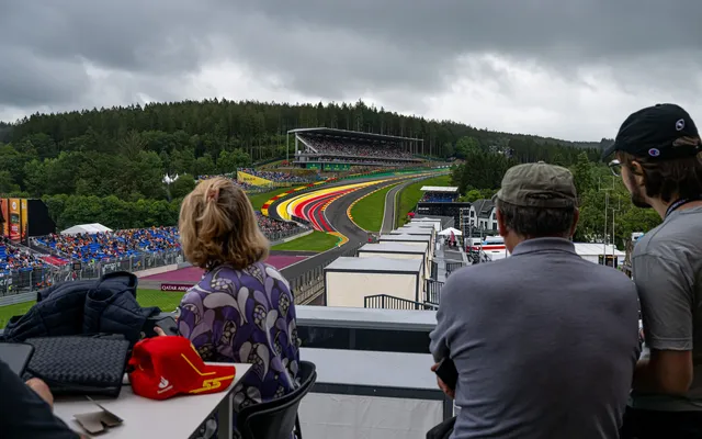 Guests watching Eau Rouge from the hospitality terrace.