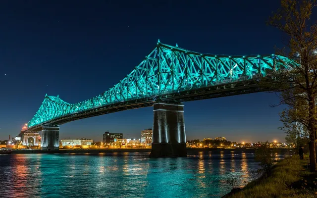 The Jacques Cartier Bridge lit at night.