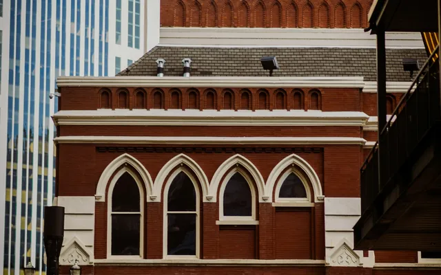 The red brick and arched windows of the Ryman Auditorium.