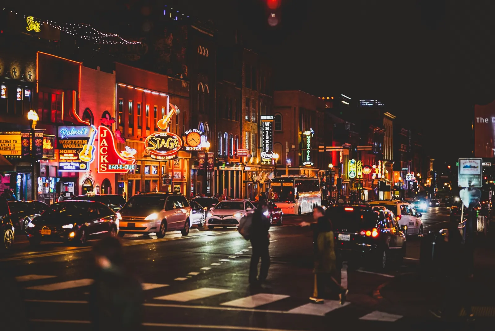 Lower Broadway at night, Nashville: honky-tonk neon and the Saturday crowd.