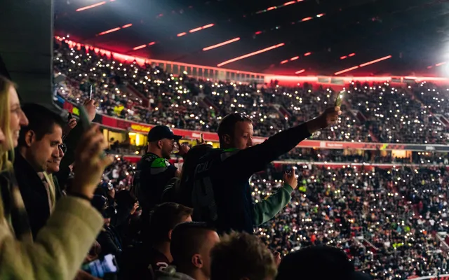 The crowd inside the Allianz Arena, phone lights up.