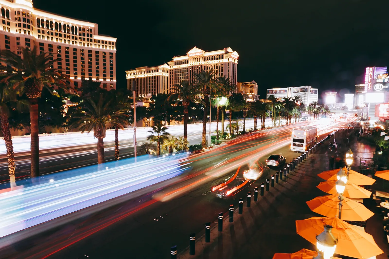 The Strip at night, lights streaking past the Bellagio.
