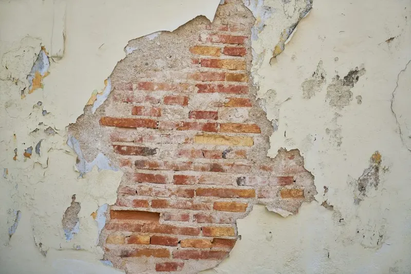 Cracked brickwork on the outside of a council property