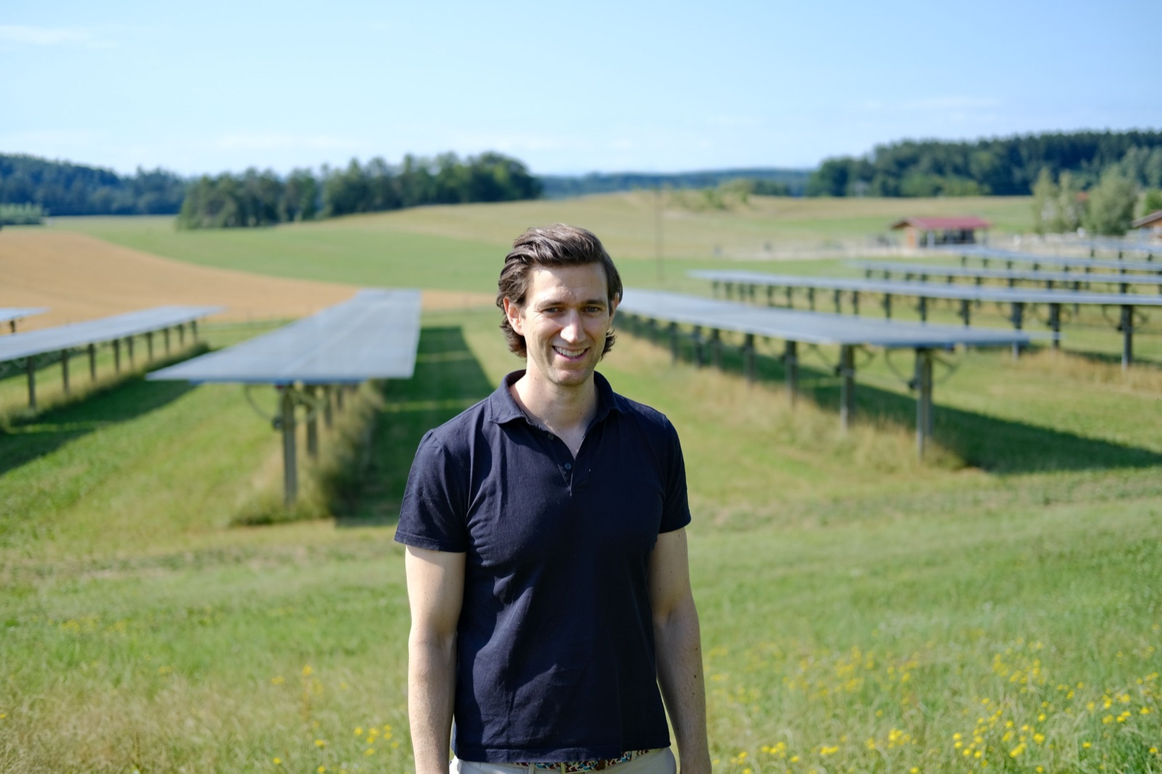 Jochen Engard standing in front of an Agri-PV installation