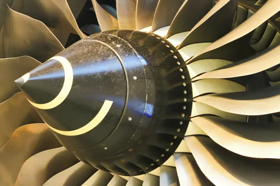 Close-up of a jet engine turbine and fan blades