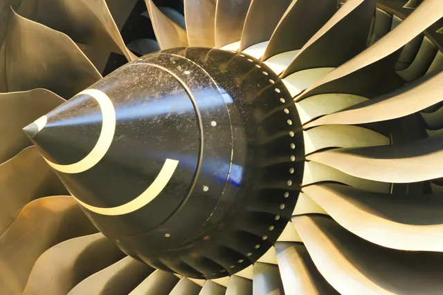 Close-up of a jet engine turbine and fan blades