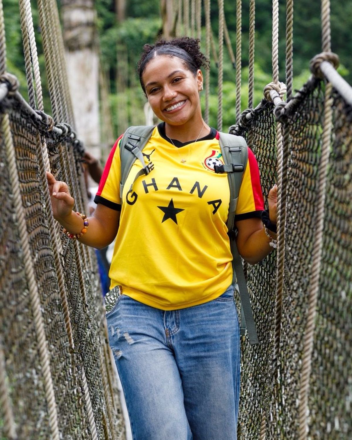A guest in a Ghana shirt on the Kakum canopy walkway