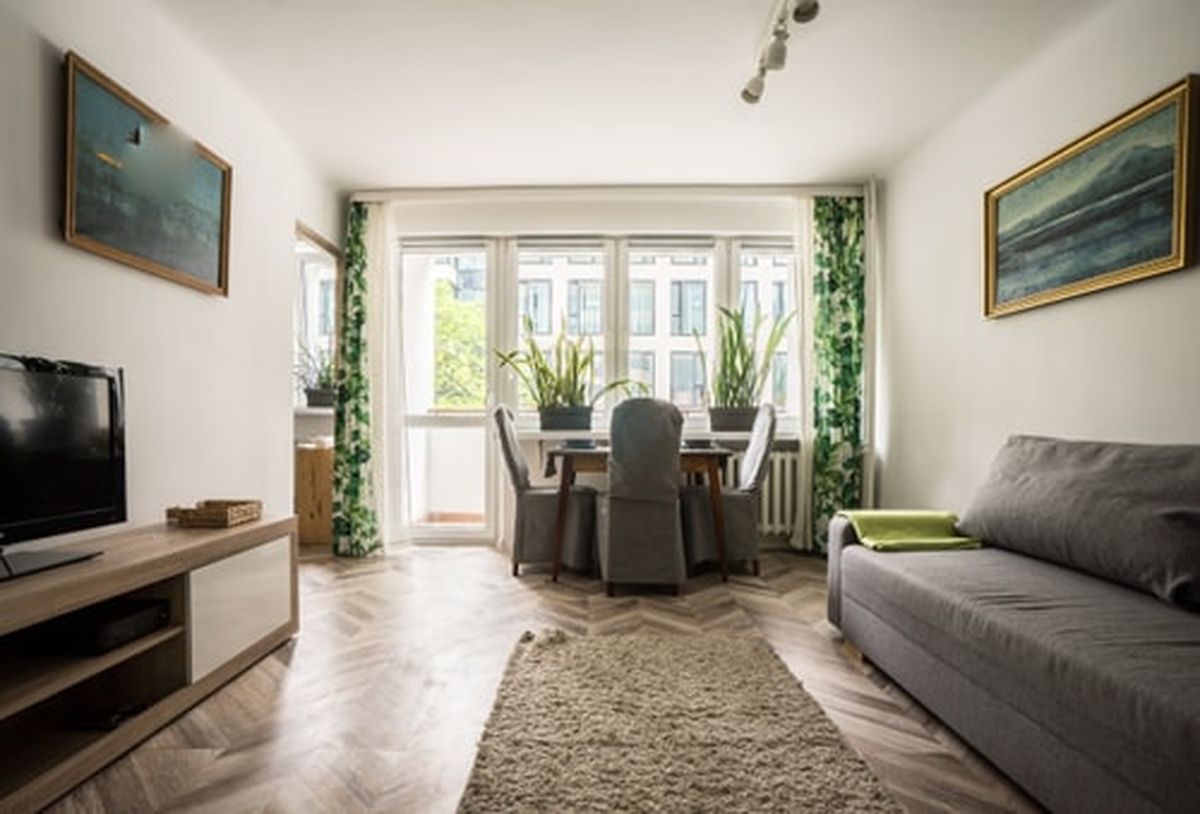 Green interior of the oompH Urban Oasis apartment in Warsaw