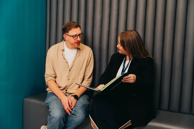Two people reviewing eye exam results before laser eye surgery