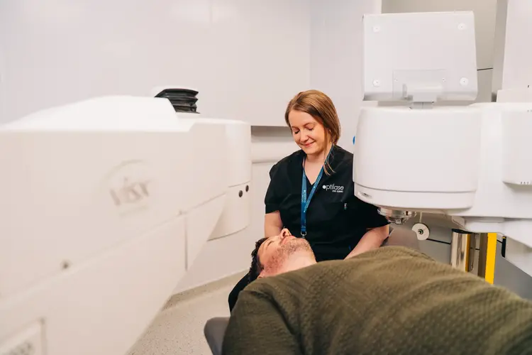Ophthalmologist preparing a patient for a LASIK procedure