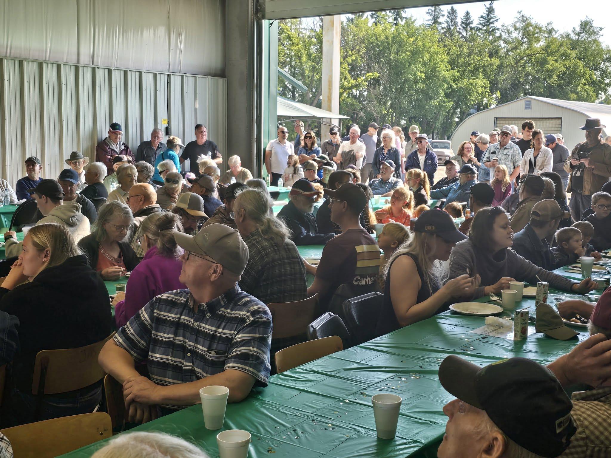 The shop filled with neighbours at long tables for the customer appreciation breakfast