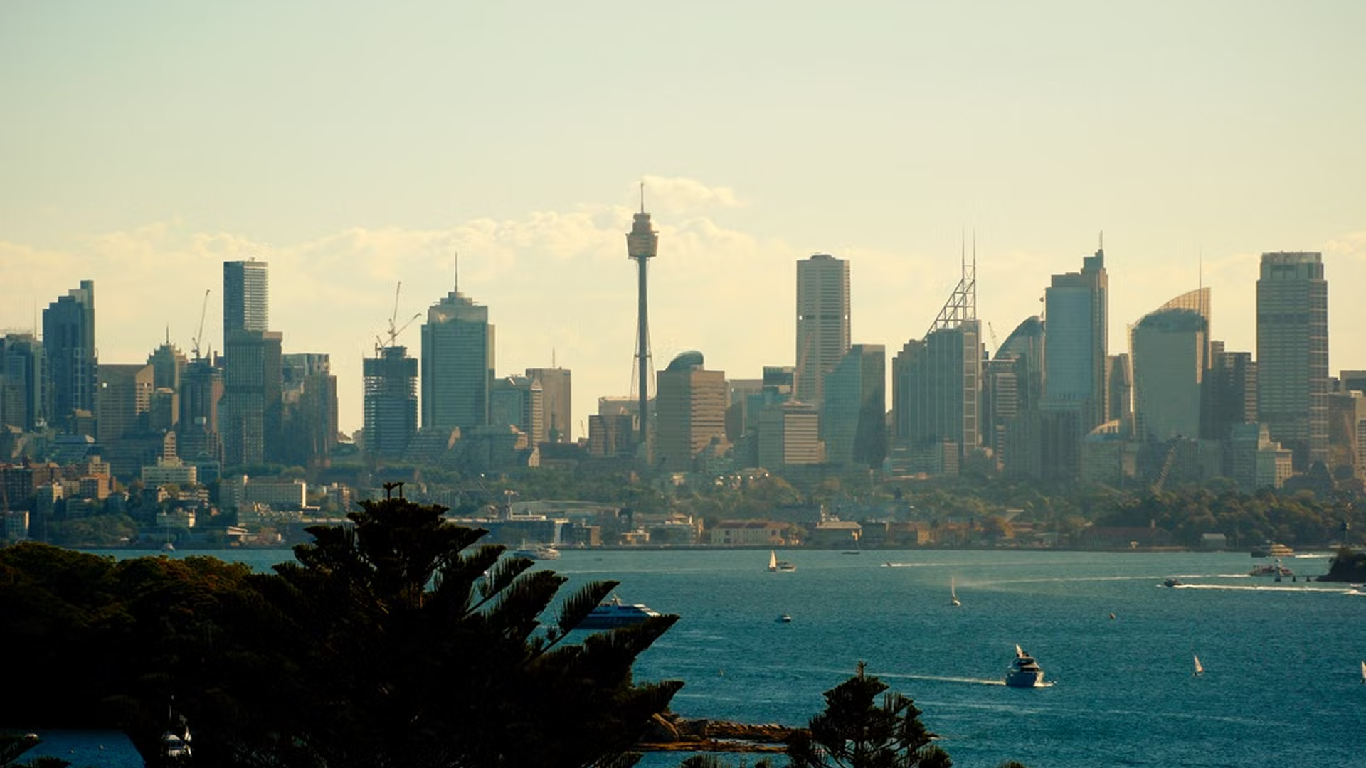 Sydney’s central business district skyline at dusk, with a graphic describing G&G Advisory Partners’ work with business owners and acquirers. If you choose a different image, adjust this description to match it.