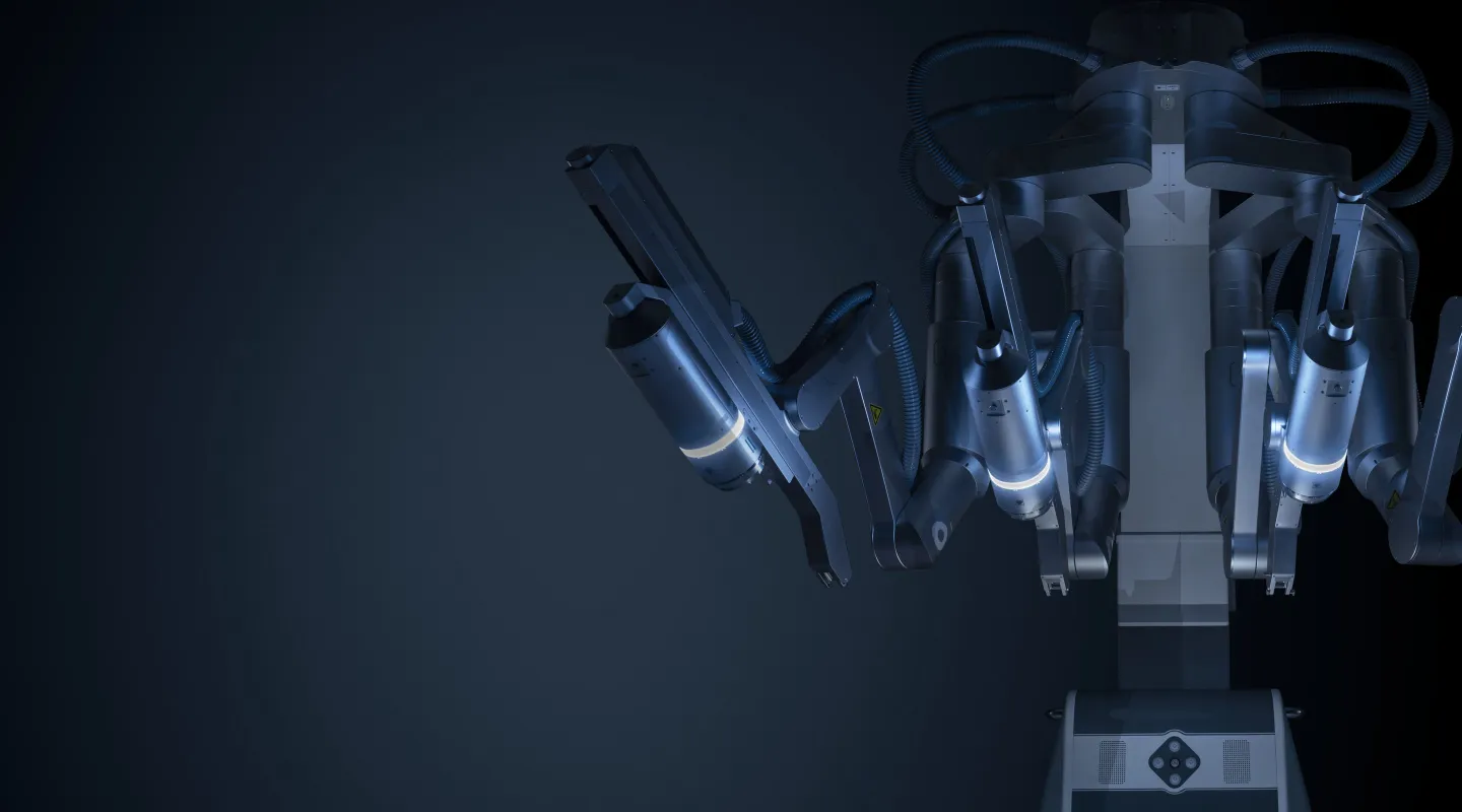 SHURUI SP surgical robot with its instrument arms raised, lit against a dark background
