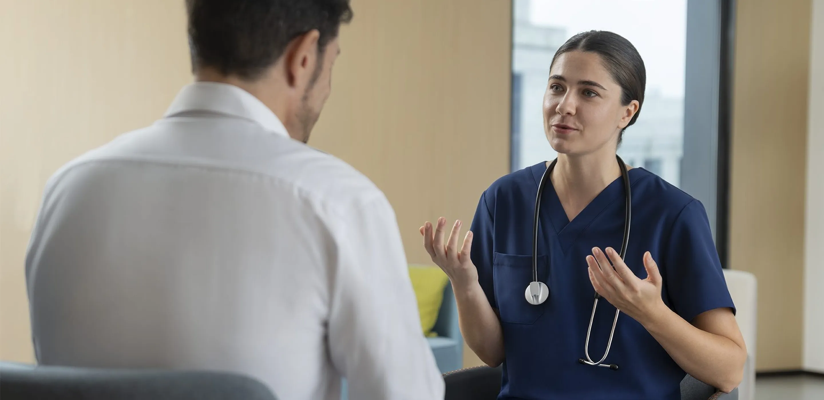 Clinician in conversation with a colleague