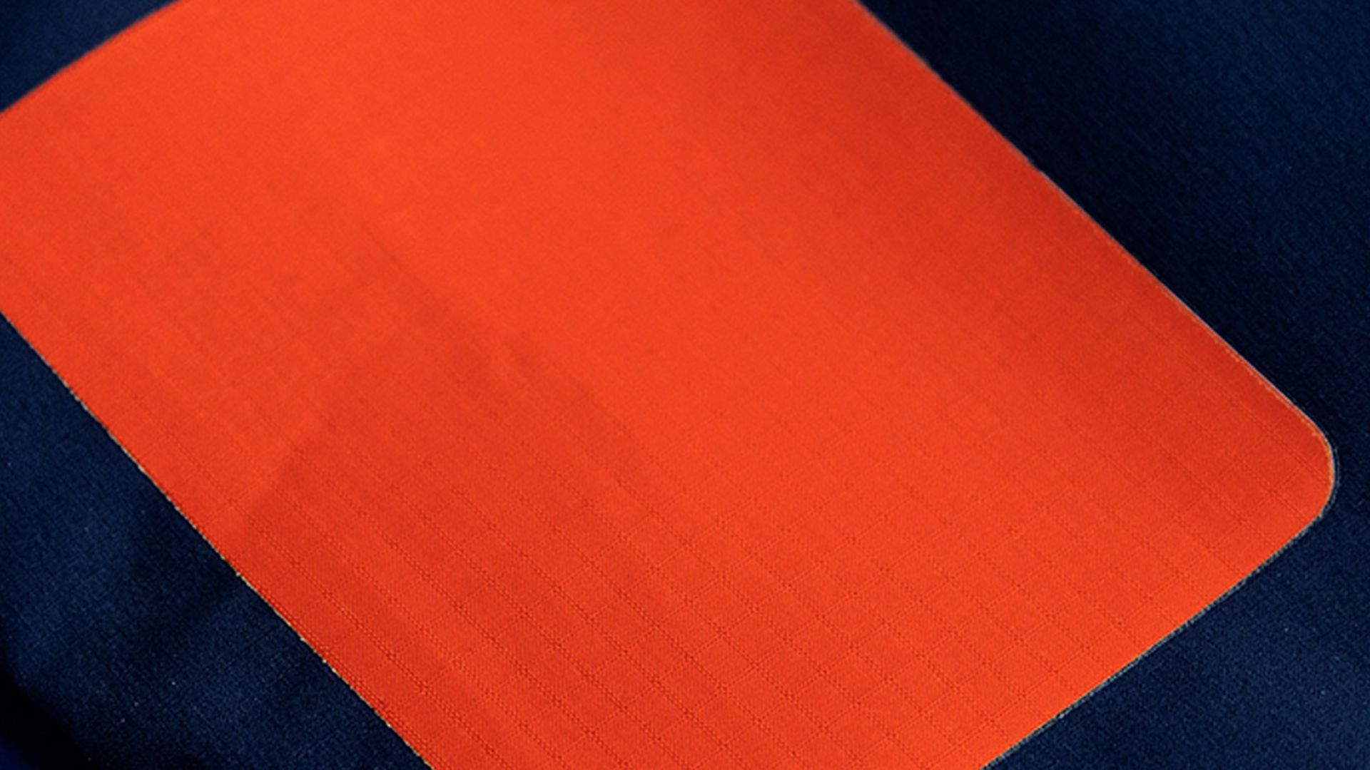 A patch repair on a waterproof jacket.