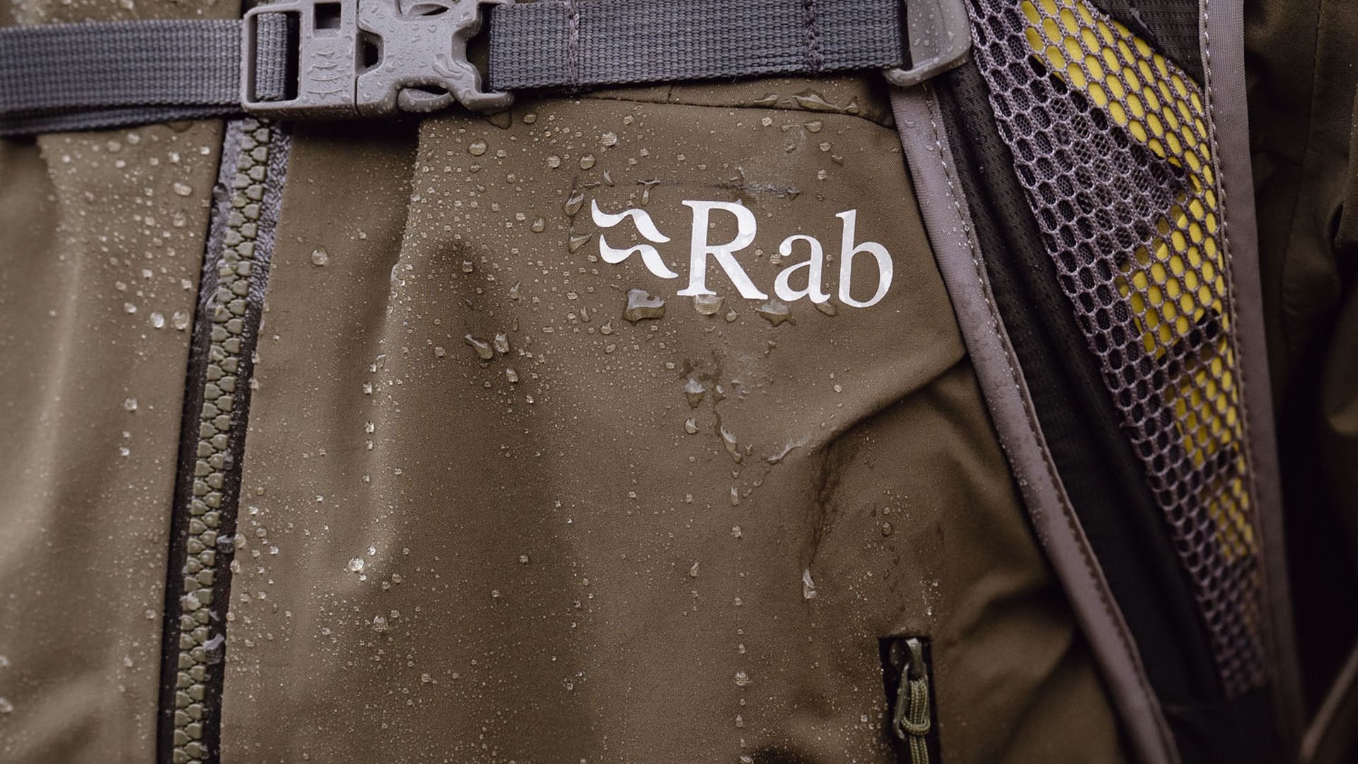 Close up of water on a waterproof jacket, showing the Rab logo