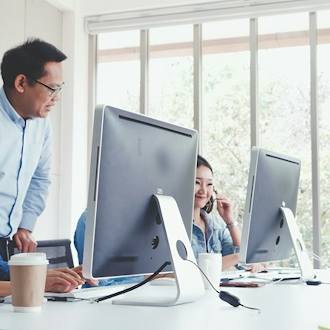 Team working at computers in a bright office