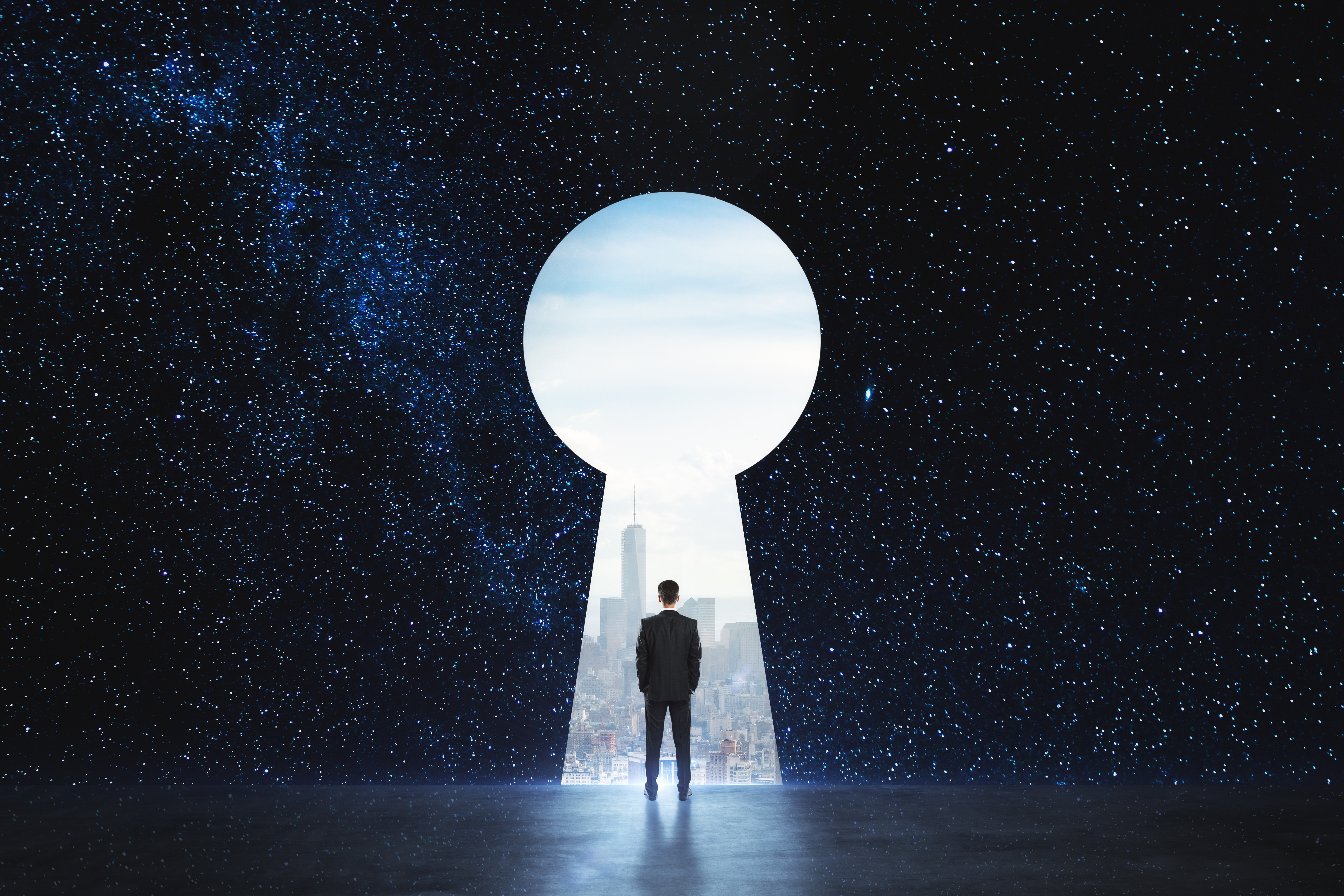 Business professional looking through a keyhole toward a city skyline
