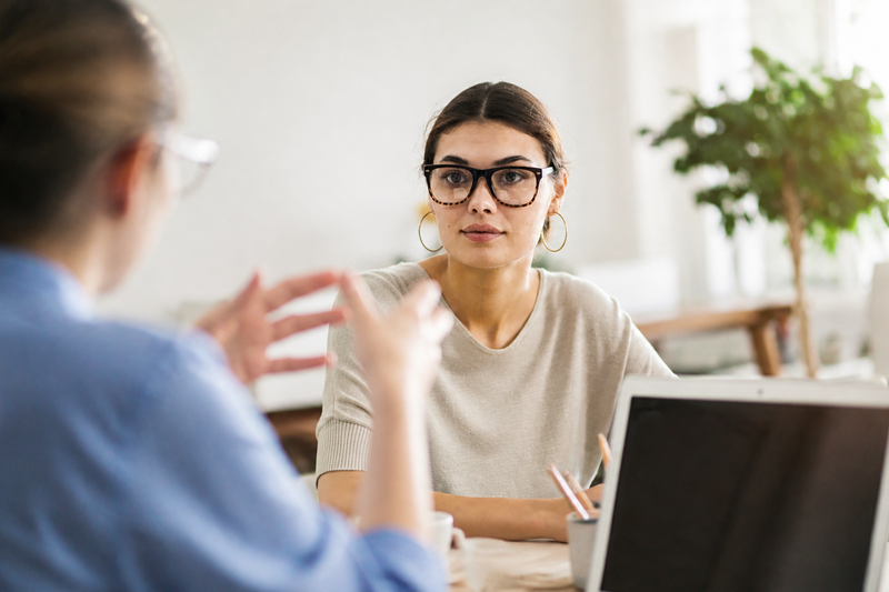 Woman on Laptop having conversation
