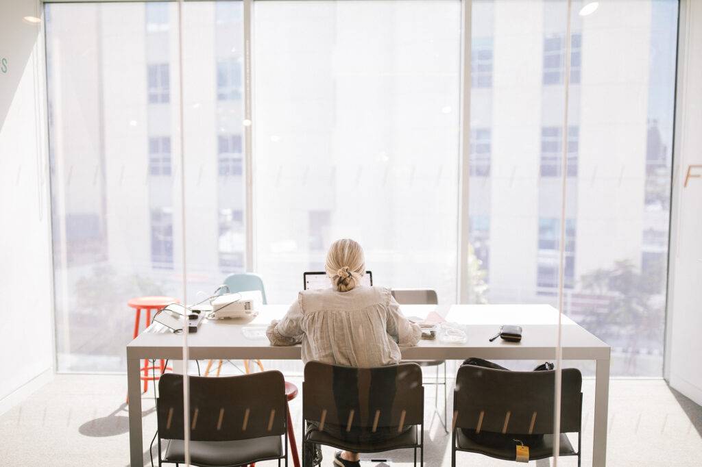 female student working on presentation in office